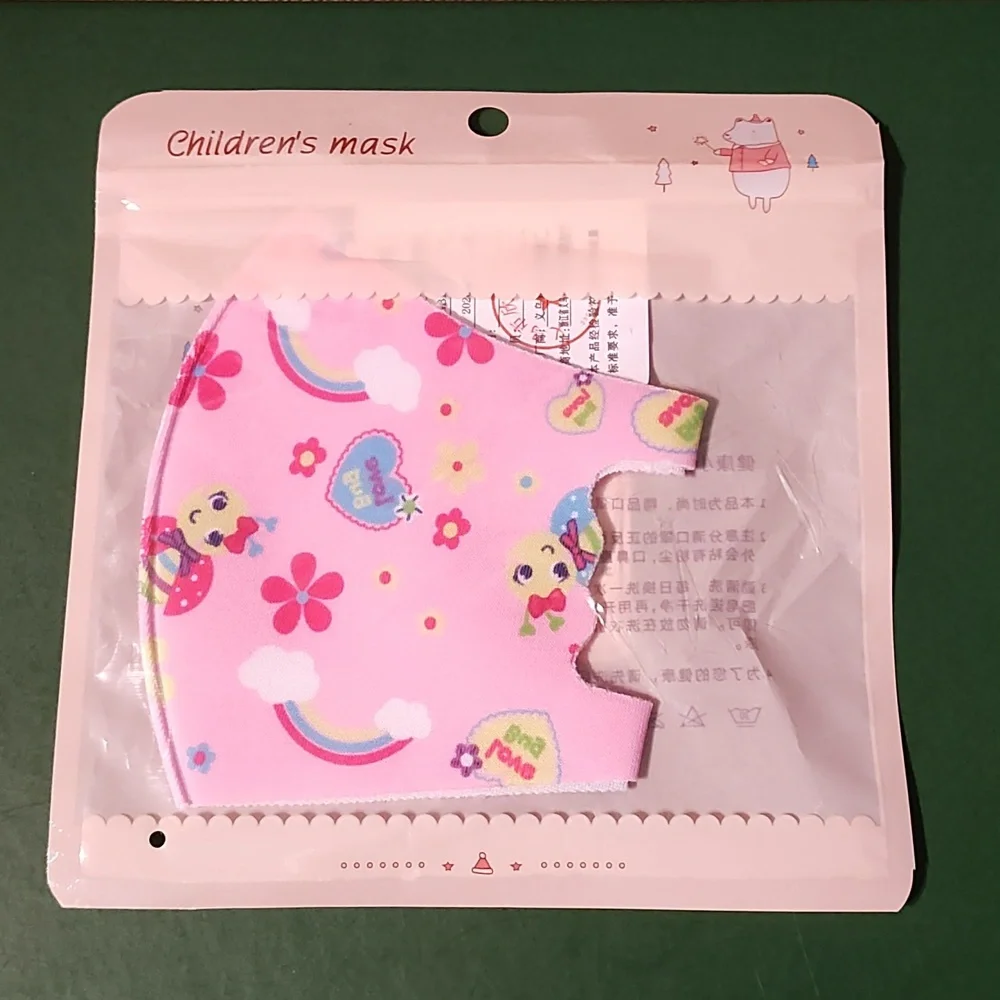 Children's re Usable face mask new in package never opened
